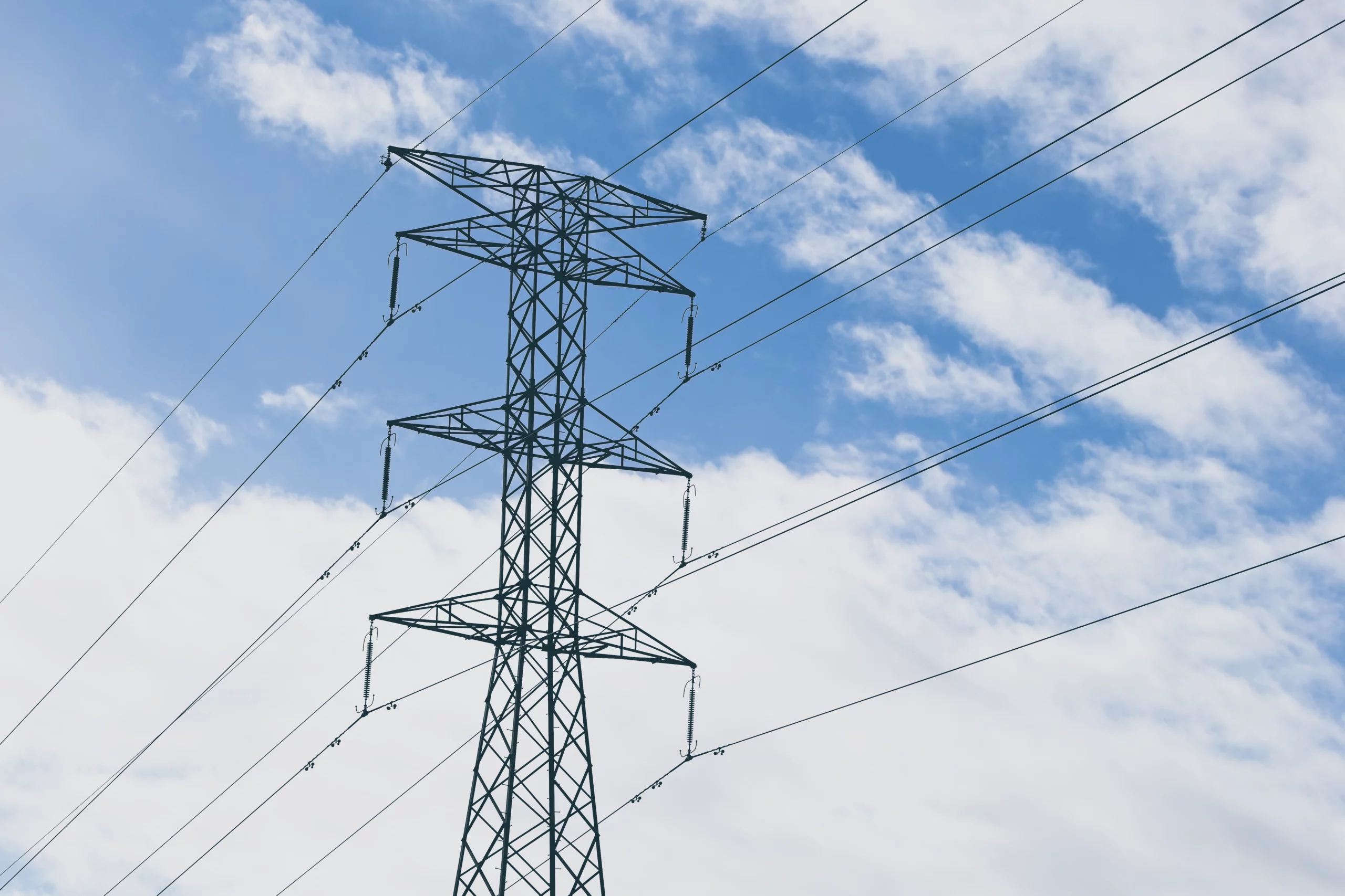 Illustrative image of the grid: picture of high power lines with blue sky background